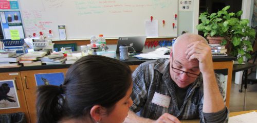 Teaching artist and clay sculptor Tim Christensen working on design principles with a student. Photo courtesy Maine Arts Commission.  