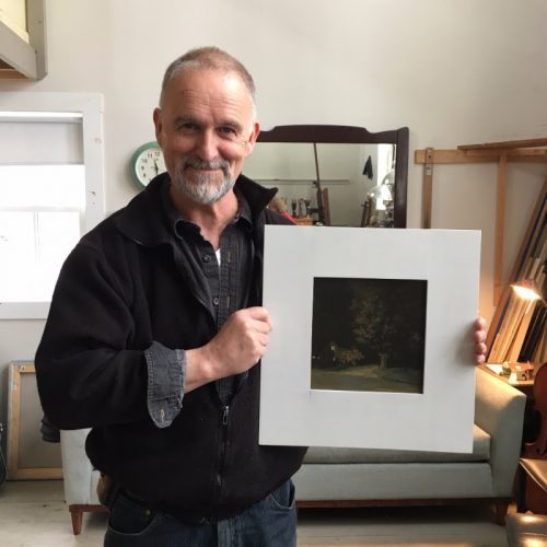 Artist Linden Frederick in his Belfast, Maine, studio, holding the painting, Midnight, 2009, that is being raffled in support of CMCA